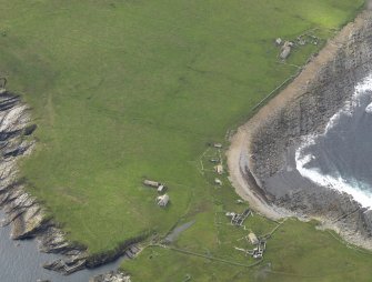 Oblique aerial view centred on the remains of the township, taken from the NE.