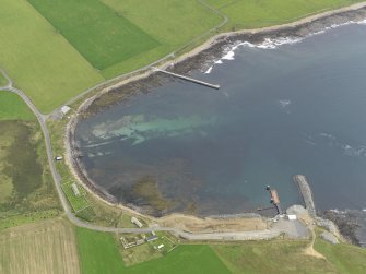 Oblique aerial view centred on the farmstead with the ferry terminal adjacent, taken from the NW.