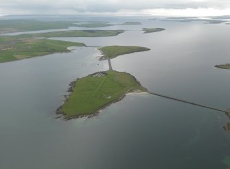 General oblique aerial view centred on Lamb Holm airfield with the causeways adjacent, taken from the ENE.