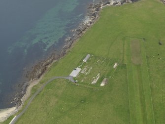 Oblique aerial view centred on the former prisoner-of-war camp with the Italian Chapel adjacent, taken from the WSW.