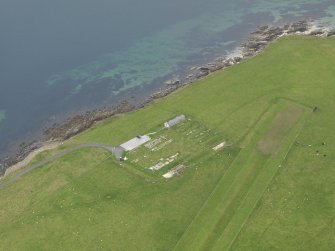 Oblique aerial view centred on the former prisoner-of-war camp with the Italian Chapel adjacent, taken from the SW.