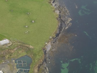 Oblique aerial view centred on the coastal gun battery, taken from the SW.