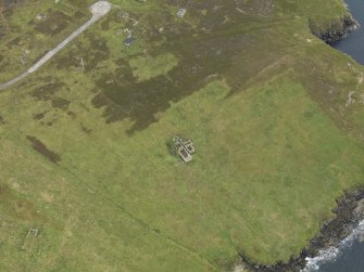 Oblique aerial view centred on the Port War Signal Station with the remains of the farmstead adjacent, taken from the NW.