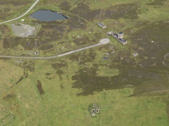 Oblique aerial view centred on the remains of the farmstead, taken from the W.