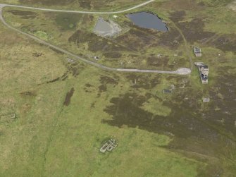 Oblique aerial view centred on the Port War Signal Station with the remains of the farmstead adjacent, taken from the WSW.