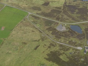 Oblique aerial view centred on the water system for the Port War Signal Station with the remains of the farmhouse adjacent, taken from the SW.