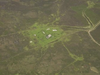 Oblique aerial view centred on military installations, taken from the NW.