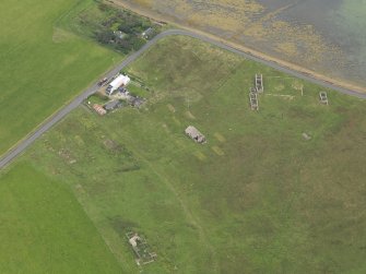 Oblique aerial view centred on the Garrison Theatre with the farmstead adjacent, taken from the NW.