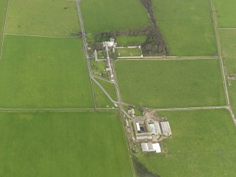 Oblique aerial view centred on the Country House with the Home Farm adjacent, taken from the SW.