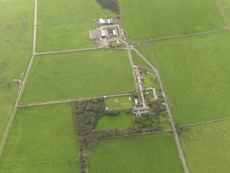 Oblique aerial view centred on the Country House with the Home Farm adjacent, taken from the ENE.