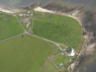 General oblique aerial view centred on the lighthouse, taken from the SE.