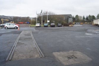 View from west looking towards 'hangar' building (NO 97333 68419, orignally used as a pattern store) with remnants of internal rails serving the site from the now dismantled railway sidings.