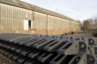 View from west of 'new' pattern shed (NO97371 68475). the castins in the foreground are treads for large quarry vehicles for a Canadian customer.