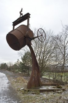 View of sculpture alongside public path on line of dismantled railway.