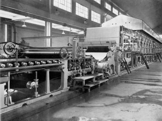 Copy of photograph of paper making machine (no.6), wet end, from the JB&S Machine 161 catalogue, James Bertram and Son Ltd, Leith Walk, Edinburgh, circa 1953. The catalogue describes and illustrates some of the features of the No 161 machine 'recently installed at the well known Mill of Guard Bridge Paper Co Ltd, Fife , Scotland designed with the co-operation of the Mill Staff especially for the economical production of the highest quality papers...'