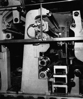Copy of photograph of paper making machine (no.6), Smoothing and Damping Rolls in a vertical stack are installed before the last section of drying cylinders. Each pair of rolls is separately driven through enclosed gearing at the back of the machine, from the JB&S Machine 161 catalogue, James Bertram and Son Ltd, Leith Walk, Edinburgh, circa 1953. The catalogue describes and illustrates some of the features of the No 161 machine 'recently installed at the well known Mill of Guard Bridge Paper Co Ltd, Fife , Scotland designed with the co-operation of the Mill Staff especially for the economical production of the highest quality papers...'
