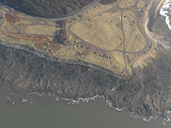 Oblique aerial view centred on the anti tank blocks, taken from the NNW.