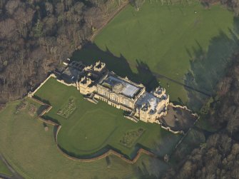 Oblique aerial view centred on the country house, taken from the SW.