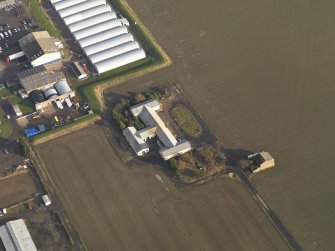 Oblique aerial view centred on the First World War mess hall, taken from the SW.