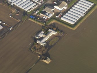 Oblique aerial view centred on the First World War mess hall, taken from the SSW.