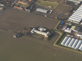 Oblique aerial view centred on the First World War mess hall, taken from the WSW.