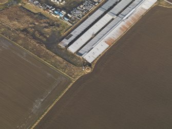 Oblique aerial view centred on the pillbox, taken from the SSW.