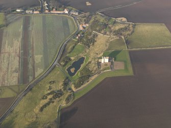 General oblique aerial view centred on the tower house, taken from the S.