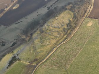 Oblique aerial view centred on the remains of the fort, taken from the SW.