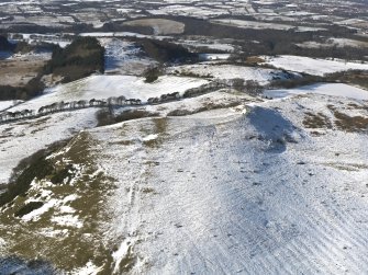 Oblique aerial view centred on the remains of the fort and rig, taken from the ENE.