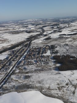 General oblique aerial view centred on the snow-covered village of Salsburgh, taken from the SW.