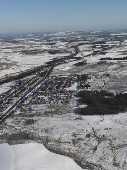 General oblique aerial view centred on the snow-covered village of Salsburgh, taken from the SW.