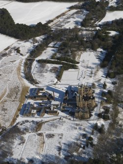 General oblique aerial view centred on the derelict hospital, taken from the SW.