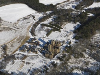 General oblique aerial view centred on the derelict hospital, taken from the SSW.