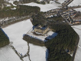 General oblique aerial view centred on the former nurses home, taken from the SSW.