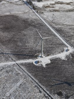 Oblique aerial view of a turbine in the Hare Hill wind farm.