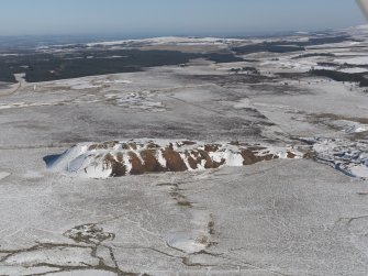 Oblique aerial view of the shale oil works bings, taken from the SW.