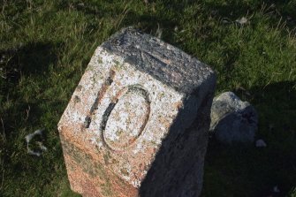 A detail of the top of the milestone.