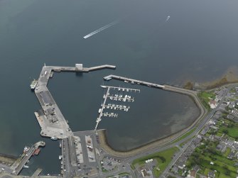 Oblique aerial view centred on the harbour, taken from the SSW.