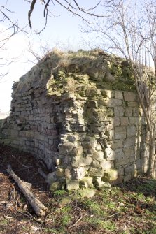 Ashlar stonework of round tower at E end showing the raggle of the demolished wall