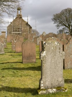 View looking E across graveyard to the W gabled elevation of Dalton Old Parish Church