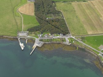 Oblique aerial view centred on the village with the harbour adjacent, taken from the E.