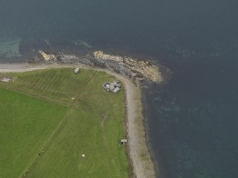 Oblique aerial view centred on the Galtness Coastal Battery, taken from the NE.