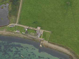 Oblique aerial view centred on Carrick House, taken from the N.
