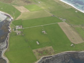 Oblique aerial view centred on the radar station with the farmstead adjacent, taken from the SSW.