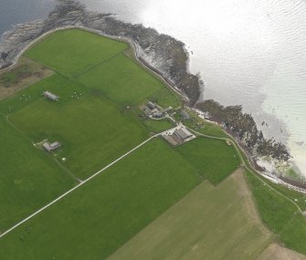 Oblique aerial view centred on the radar station with the farmstead adjacent, taken from the NNE.