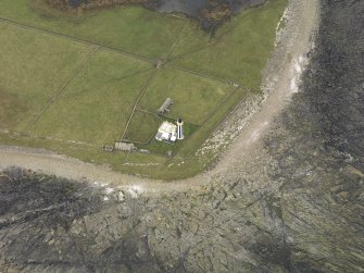 Oblique aerial view centred on the lighthouse, taken from the SE.