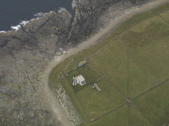Oblique aerial view centred on the lighthouse, taken from the NNE.