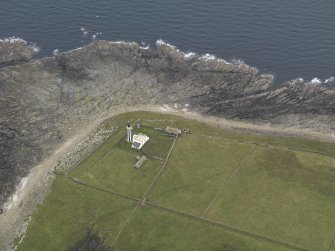 Oblique aerial view centred on the lighthouse, taken from the NNW.