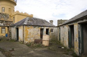 View of store buildings including the coal shed from the S.