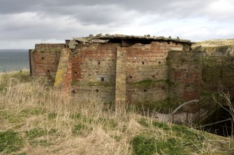 View of rear of No.1 emplacement of H group battery showing later brickwork of canopy, from S.